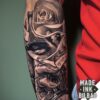 tatuaje reloj rosa pájaro y mano