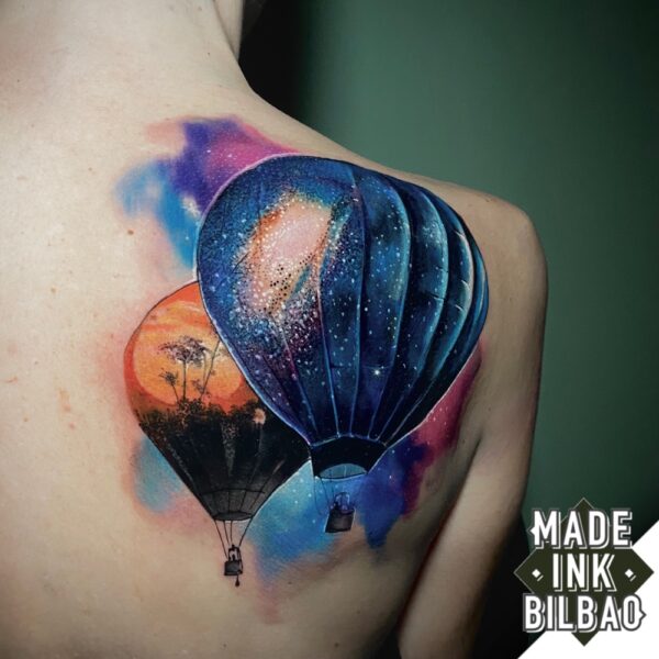 tatuaje cover espalda globos galaxia