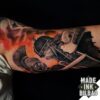 tatuaje biceps romanos