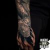 tatuaje antebrazo serpiente plantas