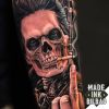 tatuaje antebrazo calavera mano guitarra