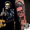 tatuaje antebrazo calavera mano guitarra