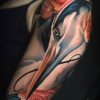 tatuaje brazo garza rosas
